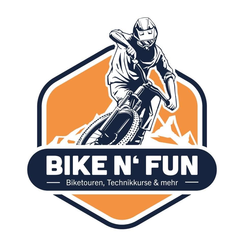 Bike n' Fun Logo Badge Bike n' Fun logo featuring a mountain biker on a dirt bike with orange mountain backdrop and navy badge design.