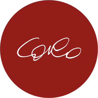 Red Circular Logo with Script Lettering Red circular logo with white script lettering on a dark red background.
