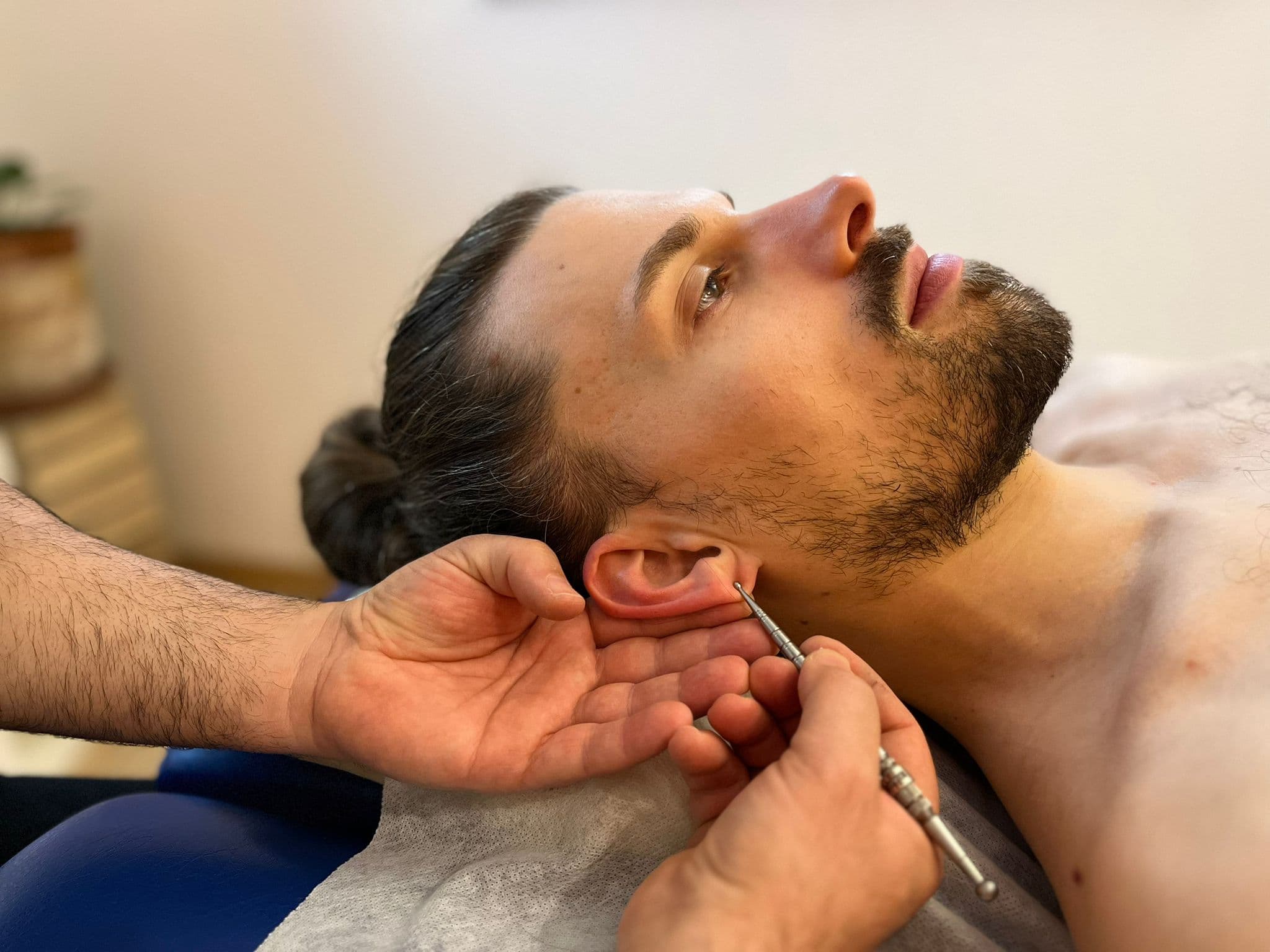 Dental Exam and Oral Check Dentist examines a patient's mouth with a dental mirror during a clinical examination.
