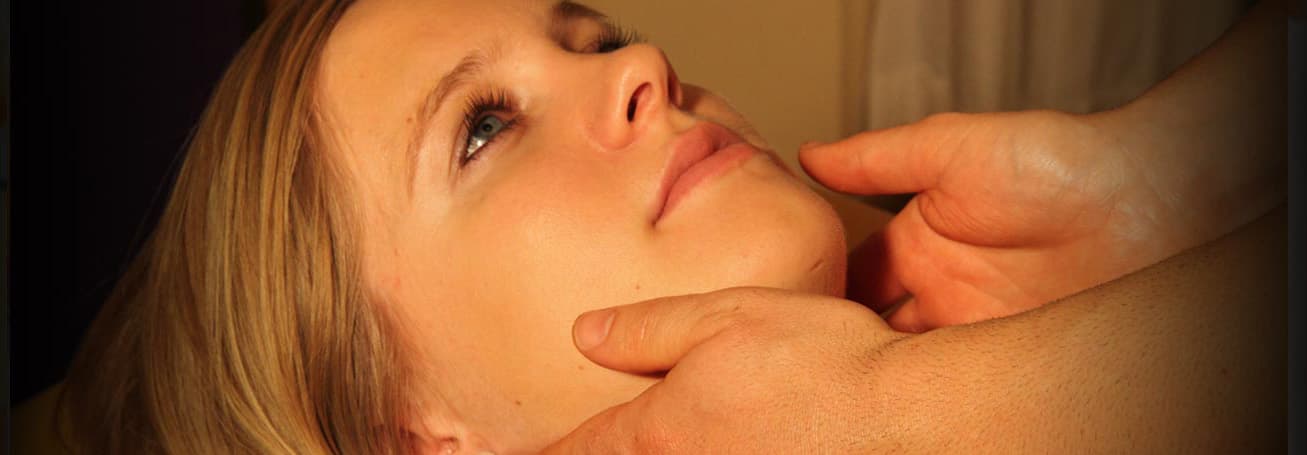Facial Massage Spa Treatment Person receiving a facial massage at a spa.